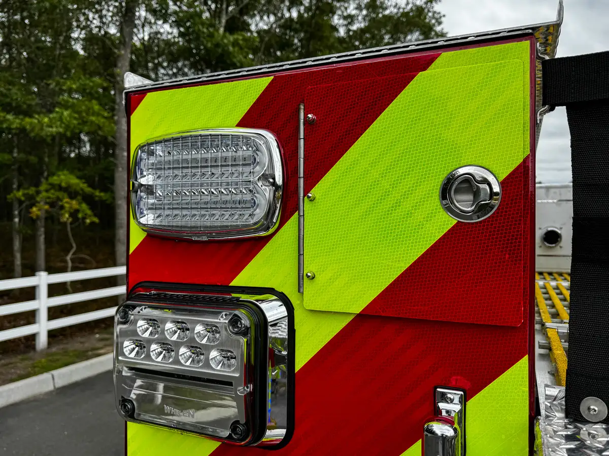 Rear roll-up compartment open view with shelf and interior storage bay.